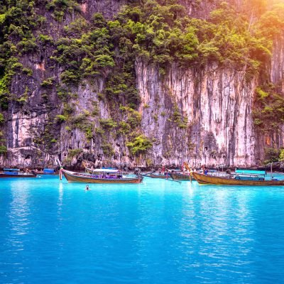 Long boat and blue water at Maya bay in Phi Phi Island, Krabi Thailand.